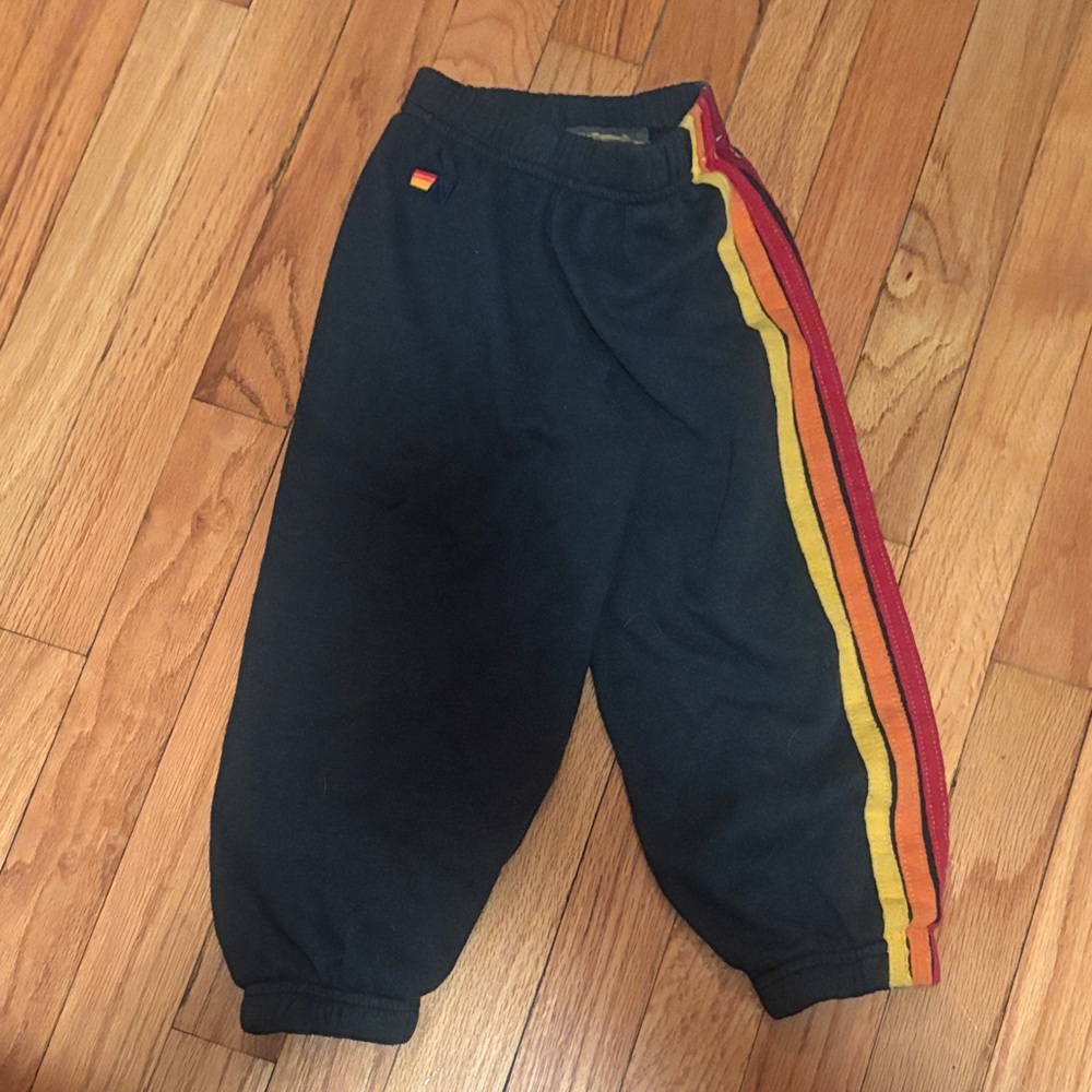 Aviator Nation Kids Black Joggers with Red and Yellow Stripes